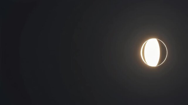 Glowing moon phase cycle showing the lunar transition from crescent to full illumination in a seamless loop animation with cinematic lighting effects against a dark deep space environment for motion p