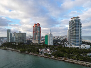 Fototapeta premium Top view of South Miami. Florida famous coastline. Miami skyline with skyscrapers. Aerial view of Miami in summer. Miami shore with skyscrapers.