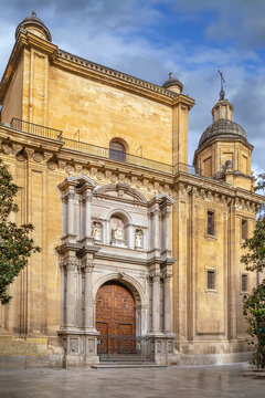 Facade of Iglesia del Sagrario in Granada Spain with stone columns. Historic church building in classicist style at day