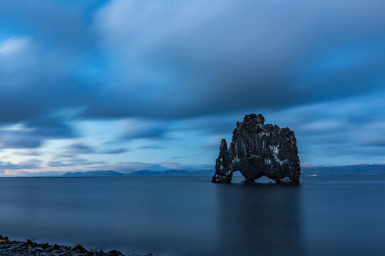 Rock formation in the middle of the water, Hvitserkur, Northern Iceland, long exposure motion blur