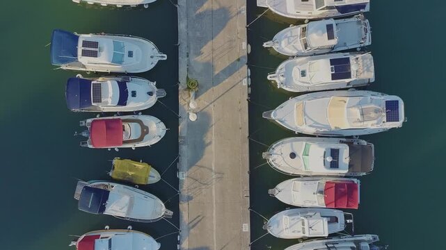 Aerial view of marina with boats and turquoise water, top view