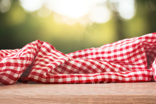 Checkered Picnic Fabric on Sunny Green Background 4k