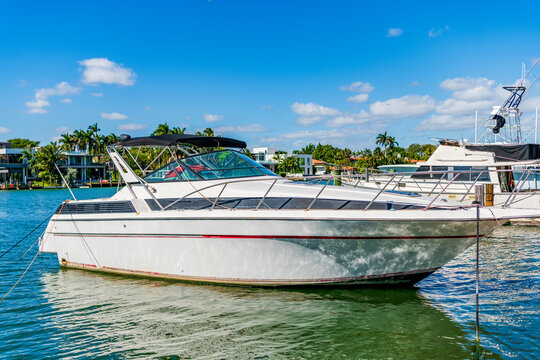 Sea vacation on summer. Luxury boat motor yacht in marina. Luxury yacht. Boating and yachting tourism. Luxurious lifestyle. Summer vacation. Docked yacht at private area