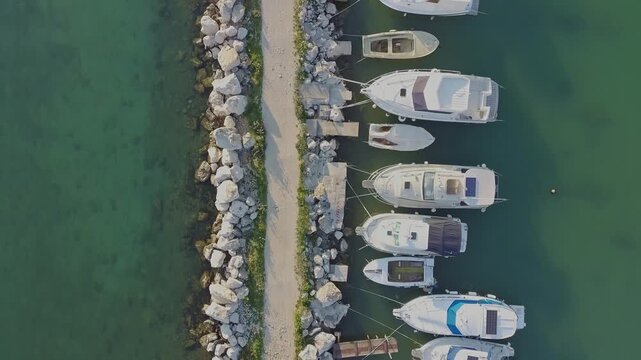 Aerial view of marina with boats and turquoise water, top view