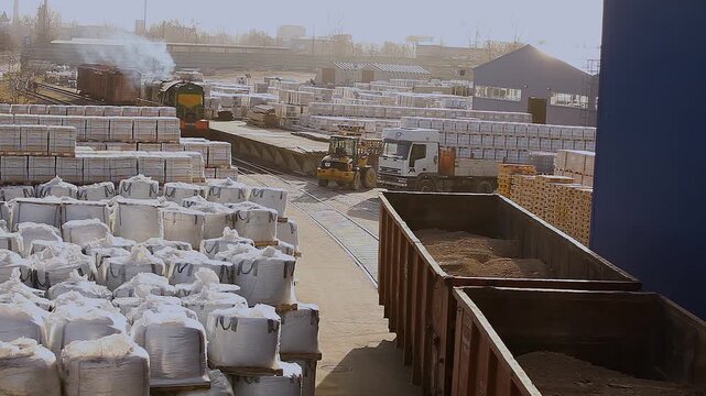 A freight car moves through a factory warehouse. Industrial rail freight transportation.