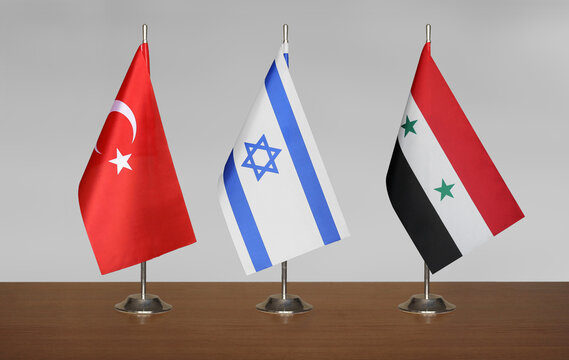 Flags T&uuml;rkiye, Israel, Syria on a gray blurred background