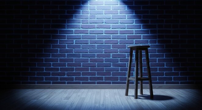Spotlight on empty stool stage.