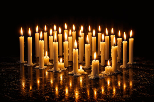 Forty white mourning candles arranged in rectangular grid on dark stone representing forty days of mourning cultural ritual remembrance collective grief spirituality Middle East mourning tradition