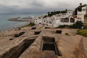Fototapeta premium Phoenician Tombs of Haffa in Tangier, Morocco, offering a historical view of the ancient city, port, and Mediterranean Sea