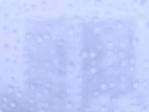 Dramatic snow blobs window bokeh background