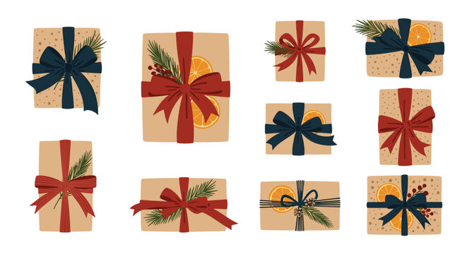 Set of various christmas gift boxes wrapped in brown paper decorated with ribbons evergreen branches orange slices and berries.