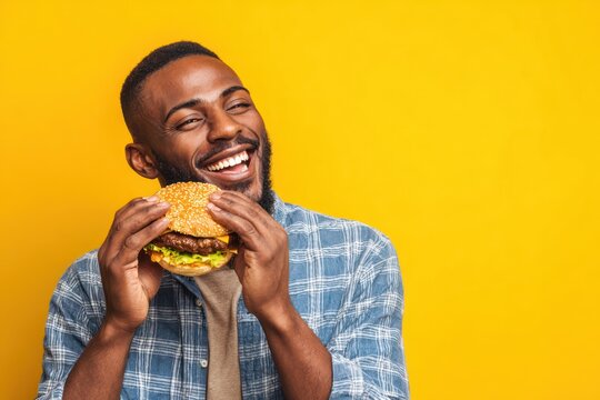 Man biting into a large burger snack