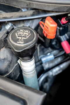 Close-up of a car windshield washer fluid reservoir cap inside the engine bay - concept of vehicle maintenance, fluid check and automotive components