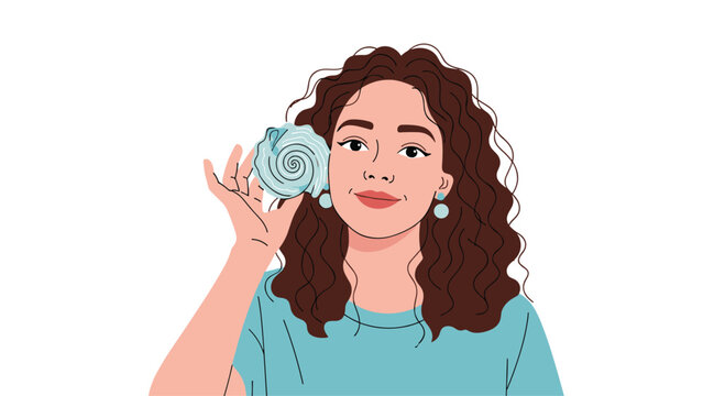 Woman with long curly hair holds a blue spiral seashell to her ear to listen to the ocean, representing summer vacations and nature connection.