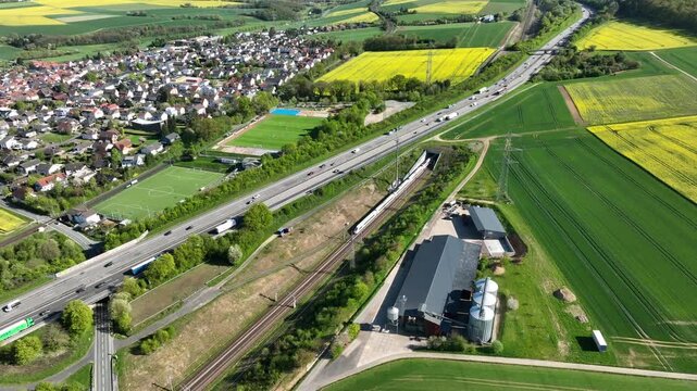 Idstein, Germany - April 23, 2026: Aerial view of German highway A3 and high speed train track between Bad Camberg and Idstein. 