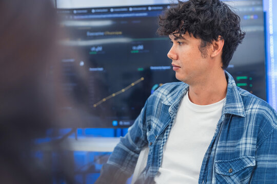 Happy Young Male Developer Discussing Project Strategy with Colleague in Modern AI Tech Office