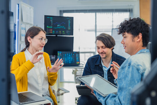 Diverse Tech Team Collaborating and Discussing Project Strategy During Coffee Break in Modern AI Office