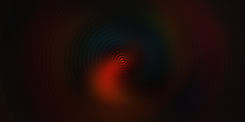 Abstract dark background with concentric circles and vibrant color variations creating a ripple effect in dim lighting. © mia