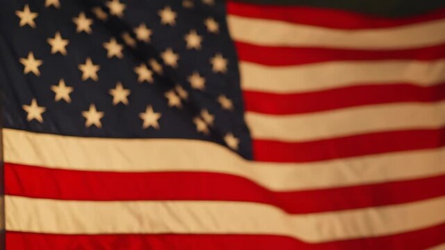 Soft-focus American flag waving gently in warm light - patriotic background. Perfect for patriotism, Independence Day, memorial tributes, or national pride themes