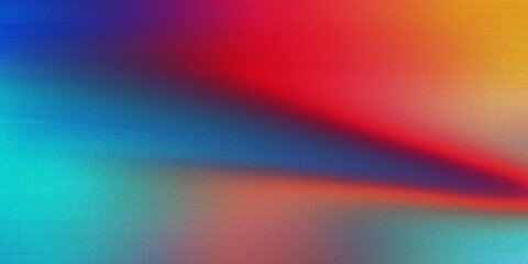 Obraz premium Abstract gradient background featuring vibrant blurred streaks of blue red and orange with grainy texture for digital design.