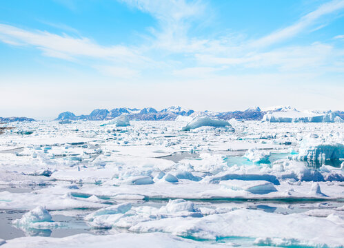 Melting of a iceberg and pouring water into the sea - Tiniteqilaaq, Sermilik Fjord, East Greenland