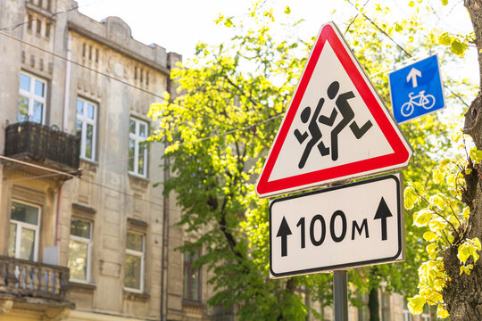 Warning traffic sign Children with 100m zone sign in Lviv