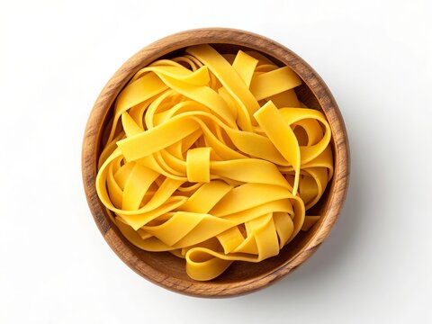 A rustic wooden bowl filled with freshly made yellow egg pasta noodles