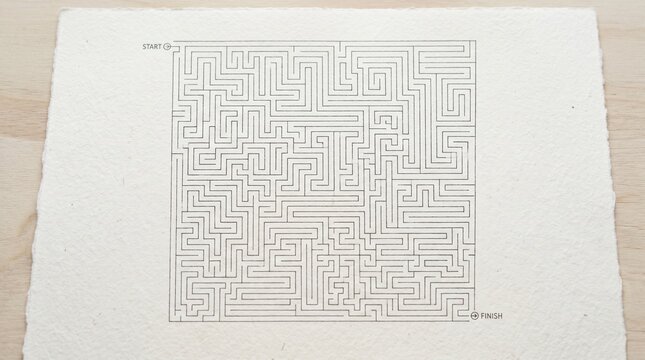 Complex square maze puzzle printed on textured paper with start and finish