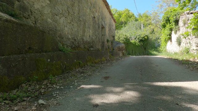 POV, on a country road in Molise with ancient stone houses