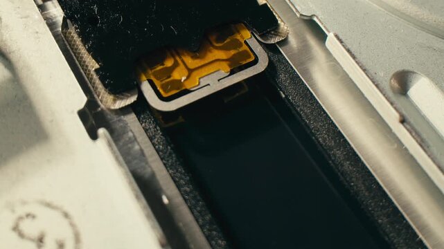 Floppy disc FDD close up, Using diskette for old PC computer macro. Archive programme or Music recorder, playing retro computer games. Vintage device for office, obsolete technology. 