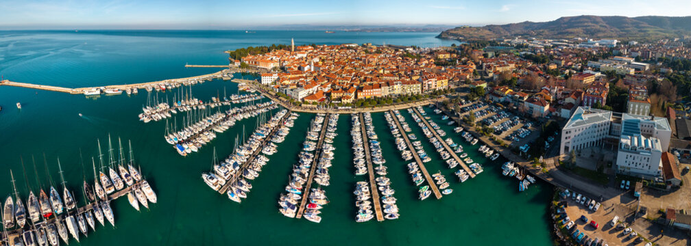 Aerial ultra wide panorama of Izola old town and large sailing marina with Adriatic sea coast Slovenia High Resolution