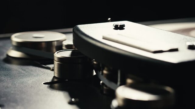 Tape audio music player, studio magnetic tape, vintage retro spool reel to reel player and recorder, magnetic tape data storage close up, music studio. 
