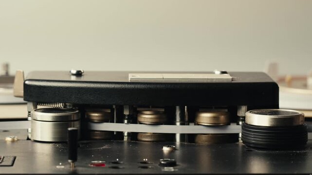 Tape audio music player, studio magnetic tape, vintage retro spool reel to reel player and recorder, magnetic tape data storage close up, music studio. 