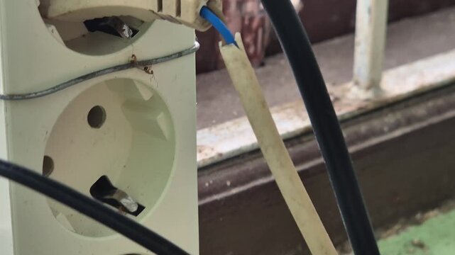 Dusty Power Strip with Multiple Electrical Adapters and Messy Cables