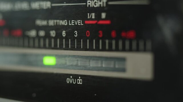 Retro radio tape recorder, audio cassette close-up. Listening to music, old radio boom box player, macro of vintage music listening. 