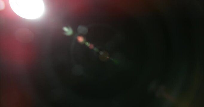 Slow motion cinematic lens flare and light leak effect isolated on black background. Perfect overlay for VFX, transitions, title reveals, film burn style and glow highlights.