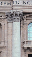 Naklejka premium Corinthian marble column capital with acanthus leaf details in neoclassical architecture on monumental historic basilica facade