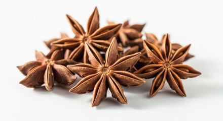 Fototapeta premium Close-up of Star Anise Pods Arranged Artistically on A White Concept Delicious Food