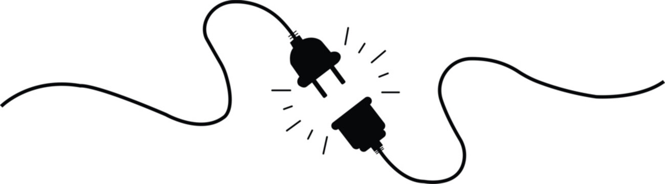 Black electrical plug and socket disconnected with sparks electricity power