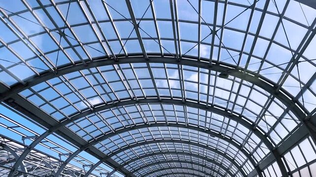 Modern glass soundproof tunnel over highway in War триsaw, futuristic urban infrastructure.
