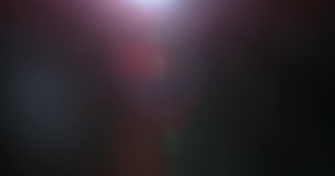 Slow motion cinematic lens flare and light leak effect isolated on black background. Perfect overlay for VFX, transitions, title reveals, film burn style and glow highlights.