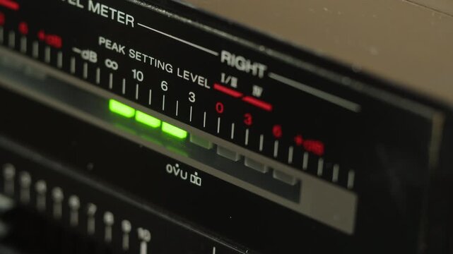 Retro radio tape recorder, audio cassette close-up. Listening to music, old radio boom box player, macro of vintage music listening. 