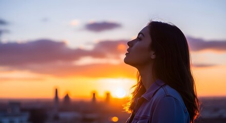 Fototapeta premium Serene Woman Inhales Fresh Air at Golden Hour Sunset Over Cityscape