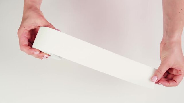 Kinesiology medical taping, doctor Physical therapist applying elastic surgical tape to patient body, treating injured knee young athlete.Post traumatic rehabilitation, sport physical therapy recovery