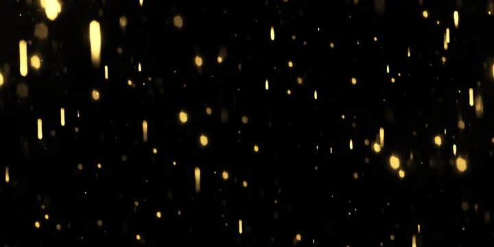 Gold dust particles fly in slow motion in the air lingering slowly. Dust Particles Background Bokeh Lights Background on Black Background 4k Footage Snow Particles Background.