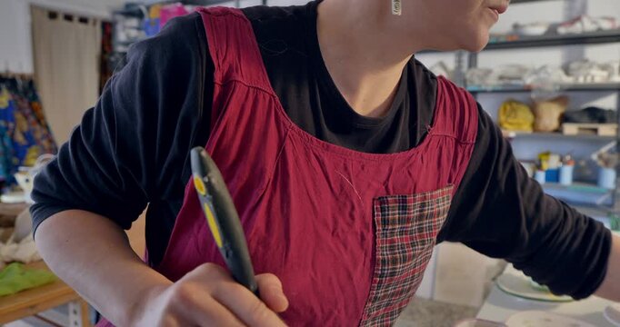 Candid Moment: A person is immersed in their daily routine, holding a pen, radiating focused intensity. 