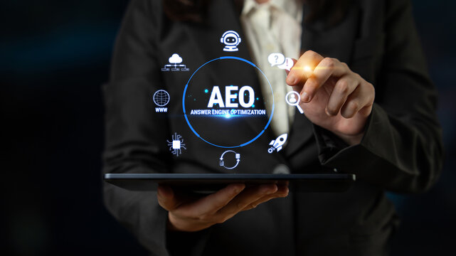 Business professional interacting with futuristic interface displaying AEO concepts for enhanced communication and digital optimization in a corporate environment Fluxor.