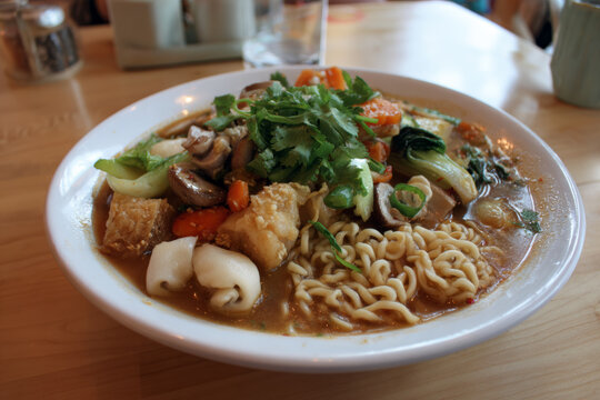 A beautifully styled food photograph of a classic Korean national noodle soup. Authentic flavors, steaming broth, and fresh noodles.