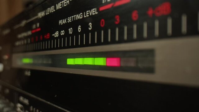 Retro radio tape recorder, audio cassette close-up. Listening to music, old radio boom box player, macro of vintage music listening. 