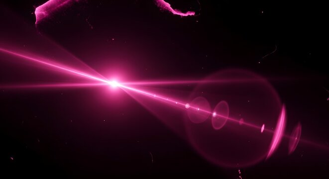 Vibrant pink laser beam shining brightly in dark space with lens flares
